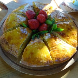 Master Classes a round pastry with strawberries on top